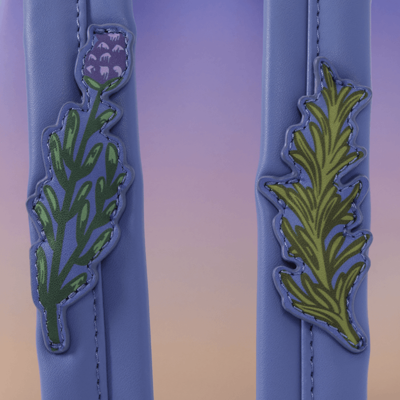 Botanical appliqué details on Practical Magic Loungefly backpack straps