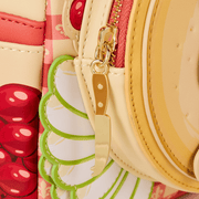 Gold cheese knife zip pull detail on the Loungefly Ratatouille Remy Cheese Wheel Mini Backpack