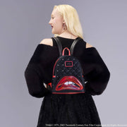 Model wearing the Loungefly Rocky Horror Lips mini backpack on the back, showing size and glossy lips pocket.