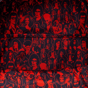 Interior lining of the Loungefly Rocky Horror mini backpack featuring red and black character collage print.