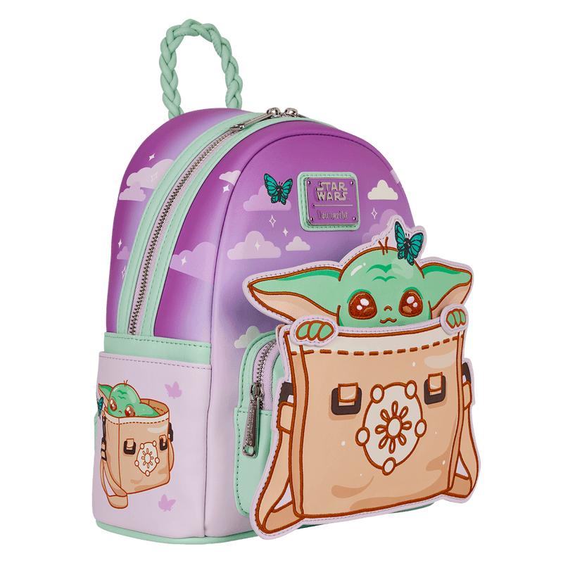 Loungefly Grogu mini backpack, front-left angle, pastel sky print with butterflies and Grogu satchel applique pocket