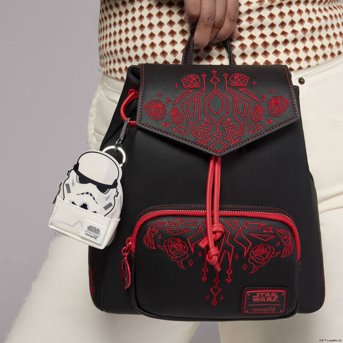 Loungefly Star Wars Stormtrooper mini backpack bag charm clipped to a black backpack