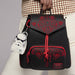 Loungefly Star Wars Stormtrooper mini backpack bag charm clipped to a black backpack