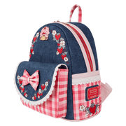 Angled view of Loungefly Strawberry Shortcake faux denim mini backpack with gingham pockets and front flap