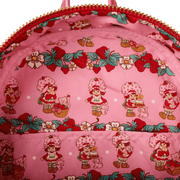 Close up of Strawberry Shortcake themed pink printed lining inside Loungefly faux denim mini backpack