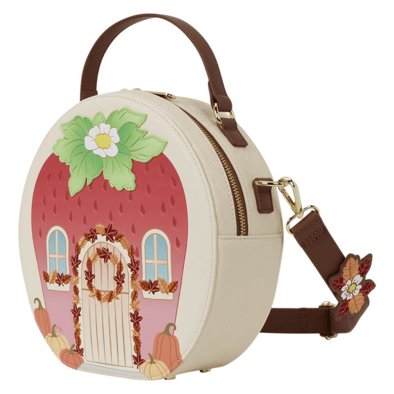 Angled view of the Loungefly Strawberry Shortcake Strawberry House Crossbody Bag