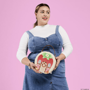 Loungefly Strawberry Shortcake Strawberry House Crossbody Bag worn by a model