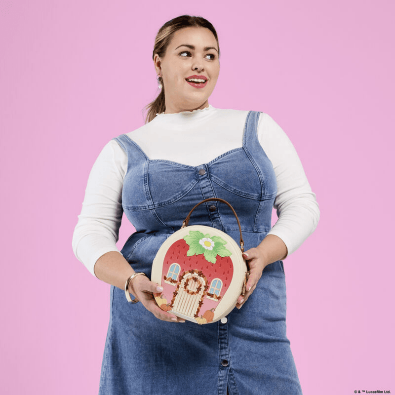 Loungefly Strawberry Shortcake Strawberry House Crossbody Bag worn by a model