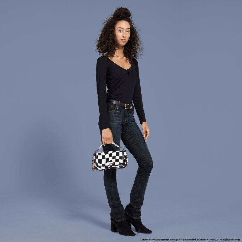 Model carrying the Loungefly Art the Clown Crossbody Bag