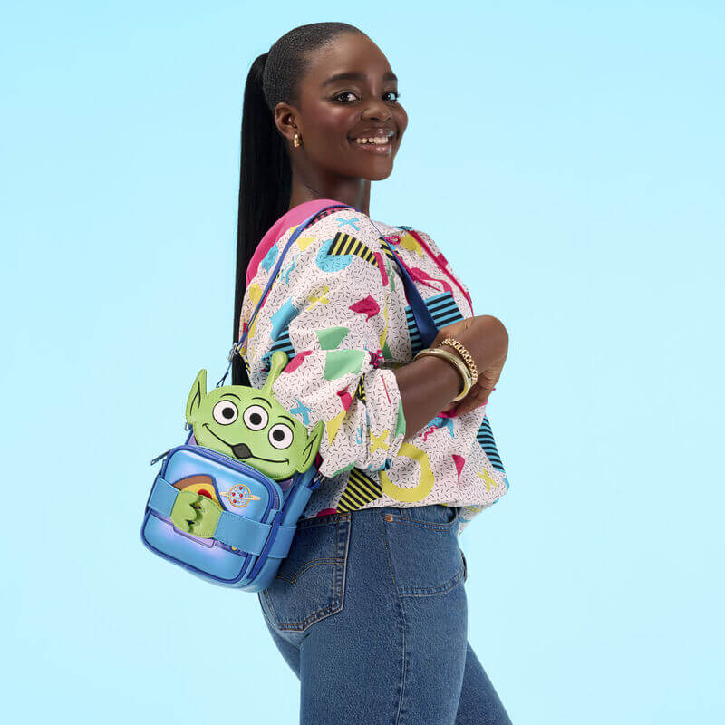 Model wearing Loungefly Toy Story Alien Crossbuddies crossbody with pizza pouch