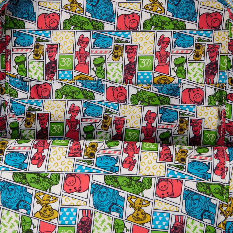 Toy Story 30th interior lining with character panels—Woody, Buzz, Rex and Hamm—inside the Loungefly mini backpack