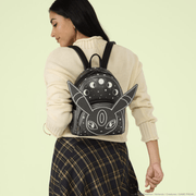 Model wearing Loungefly Pokémon Umbreon mini backpack with large character ears and celestial moon phase design