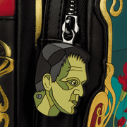 Close up of the Loungefly Universal Monsters Bride of Frankenstein mini backpack showing the Frankenstein silicone zipper charm