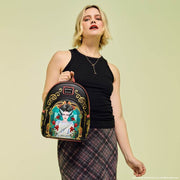 Model holding the Loungefly Universal Monsters Bride of Frankenstein Stained Glass Mini Backpack
