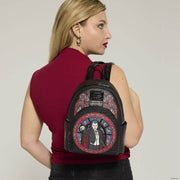 Model wearing the Loungefly Universal Monsters Dracula Stained Glass Mini Backpack showing the stained glass Dracula front pocket