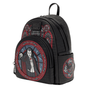 Side view of the Loungefly Universal Monsters Dracula Stained Glass Mini Backpack with black brick-effect body and red gothic artwork