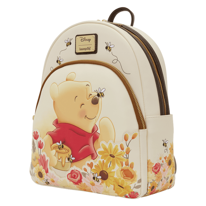 Loungefly Winnie the Pooh backpack angled view with floral print and bees