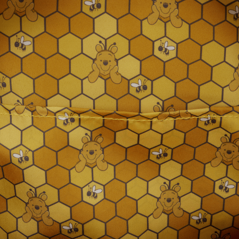 Loungefly Winnie the Pooh backpack interior lining honeycomb pattern with bees