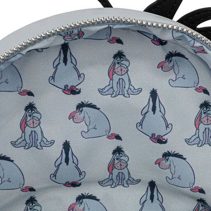 Interior lining of Loungefly Winnie the Pooh Eeyore mini backpack with Eeyore print