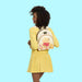 Model wearing Loungefly Winnie the Pooh mini backpack cream floral design