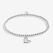 Full view of Joma Jewellery A Little Love You Mum Bracelet, silver-plated beaded stretch Bracelet with sparkly heart charm.