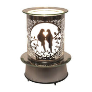 Lit view of rotating wax melt burner with dove design and heart-shaped pose

