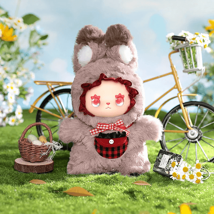 Greygrey Wolf plush mini, grey hooded outfit and cherry backdrop

