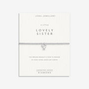 “Sentiment display card reading ‘A Little Lovely Sister’ with bracelet attached”
