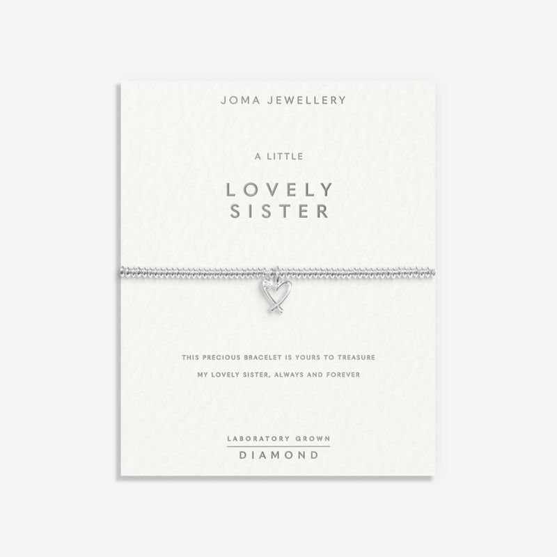 “Sentiment display card reading ‘A Little Lovely Sister’ with bracelet attached”
