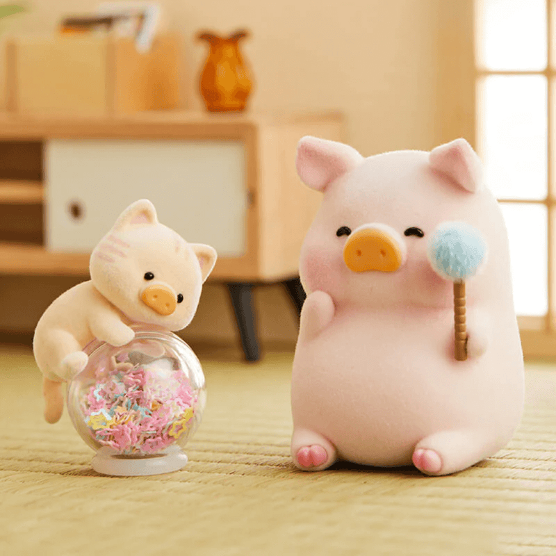 “Kitty Teaser” LuLu holding fluffy wand while kitten climbs a sweet-filled globe – Blind Box collectable
