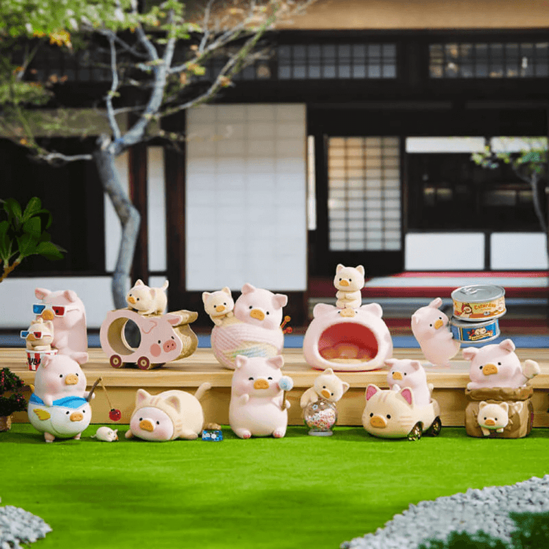 Outdoor group shot of all LuLu the Piggy Caturday Series Blind Box figures on grass scene

