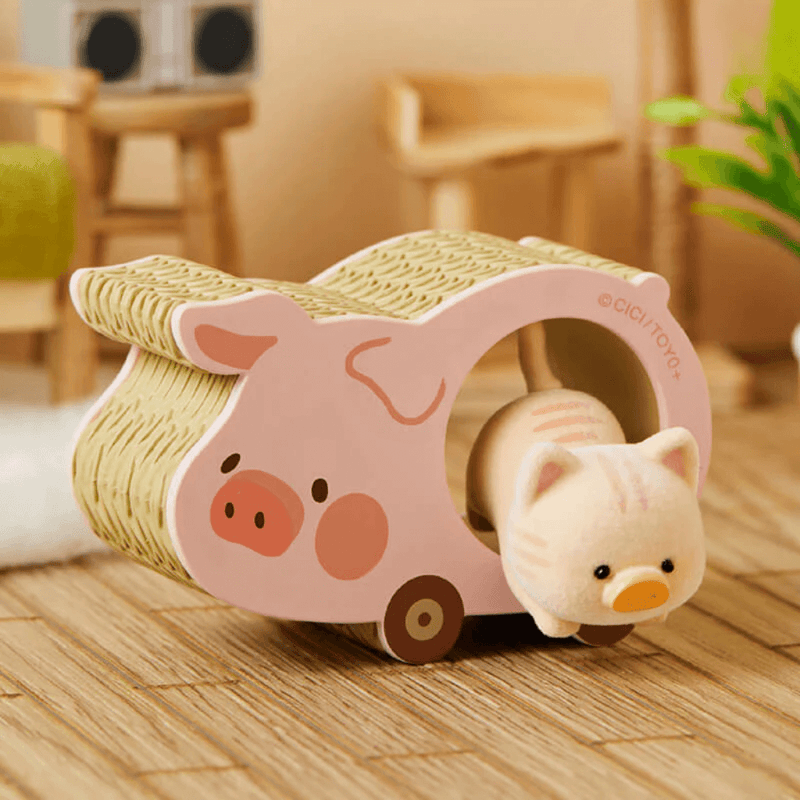 “Scratcher” kitten racing through a pig-shaped scratch toy – LuLu the Piggy Caturday Blind Box collectable
