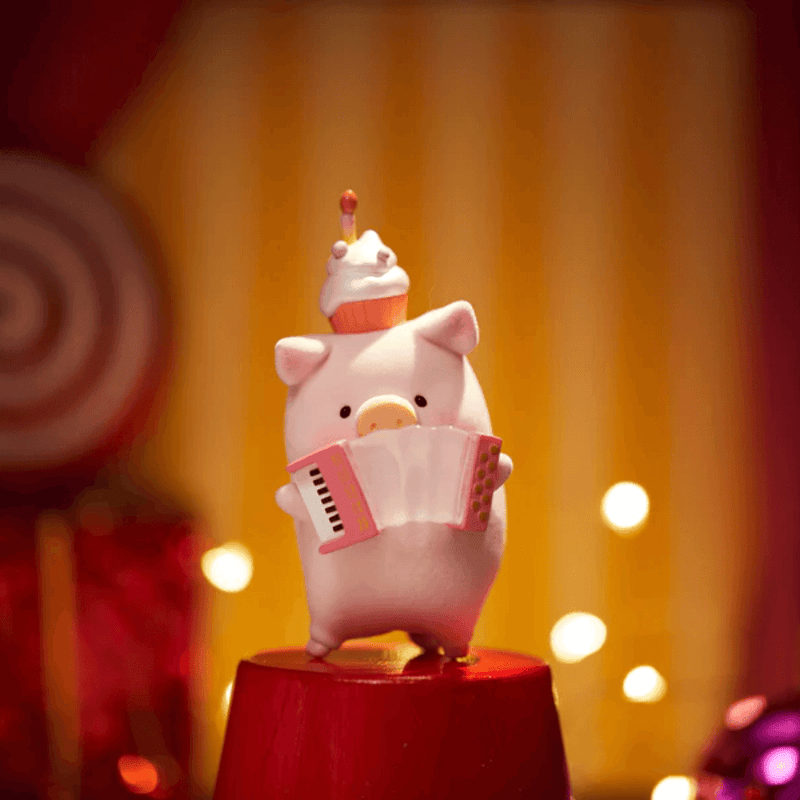 “Accordion Player” LuLu balancing cupcake hat while squeezing pink accordion – Celebration Blind Box figure
