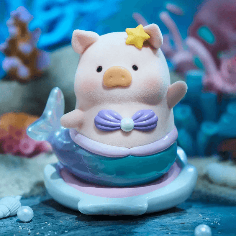 “Mermaid” LuLu with seashell bra and teal tail waving under-sea – Ocean Series Blind Box collectable
