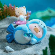 “Seal” LuLu lounging with crystal orb while kitten mermaid sits behind – Ocean Blind Box figure
