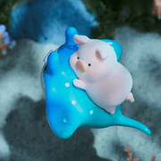 “Stingray” LuLu clinging to spotted blue ray gliding over sandy seabed – Blind Box collectable
