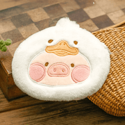 Duck Lu plush pouch—white duck hood with yellow bill—photographed on rustic wooden surface.
