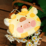 Giraffe Lu plush pouch with yellow spots and little ossicones, pictured beside daisies.
