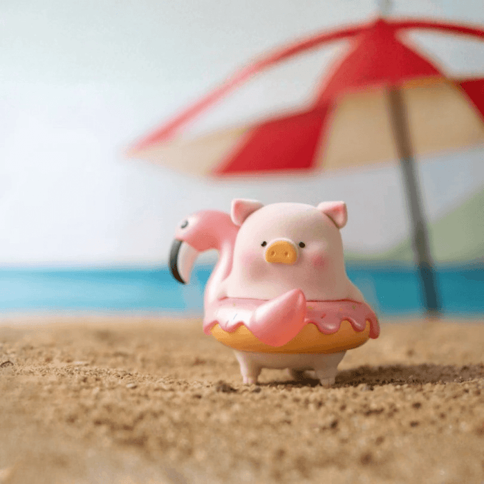 LuLu the Piggy Beach Party Blind Box Series Flamingo figure wearing a pink flamingo swim ring