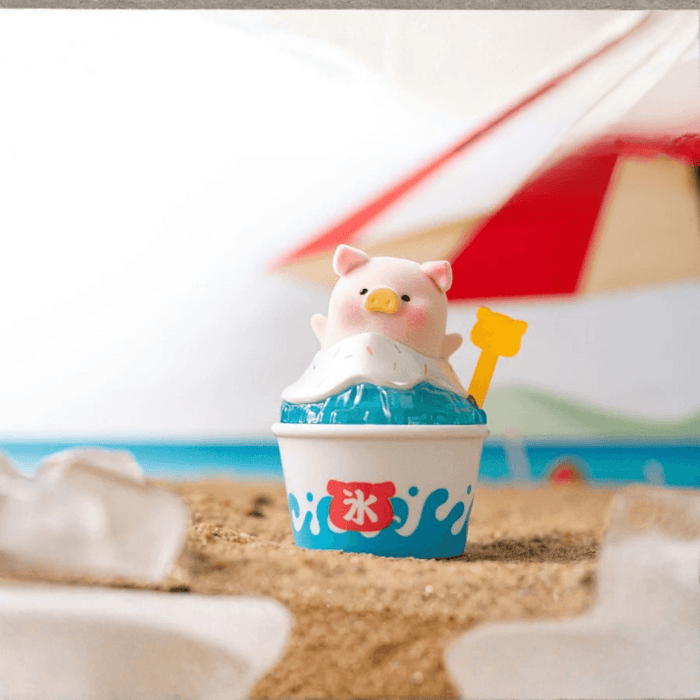 LuLu the Piggy Beach Party Blind Box Series Shaved Ice figure sitting in a blue shaved ice cup with spoon