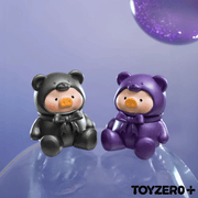 Lulu The Piggy mini figurines in black and purple teddy suits on a purple background