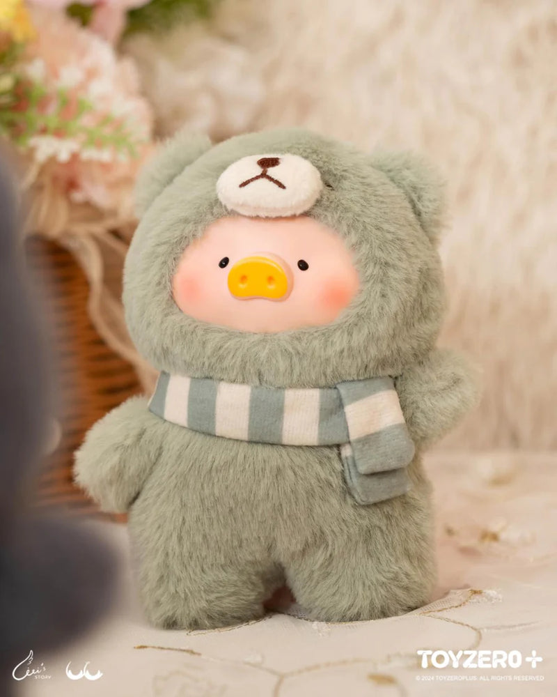 Lulu the Piggy Joyful Time blind box plush in sage-green teddy outfit with striped scarf, set against cosy floral décor.
