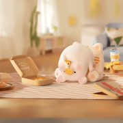 Lulu the Piggy Home Life blind box “Pizza Nap” figure—pig snoozing face-down on cat cushion with pizza slice stuck to snout.
