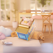 Lulu the Piggy Home Life blind box figure playfully peeking out of a retro blue tin can with gold lid in a cosy kitchen diorama.

