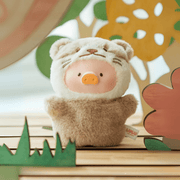 Lulu the Piggy Clumsy Otter blind box keyring, fuzzy brown otter suit framed by hand-cut woodland props.
