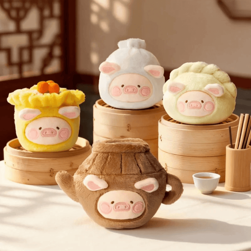 LuLu the Piggy Dim Sum House plush keychain display on bamboo steamers
