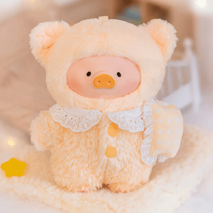 Lulu the Piggy Disciplined plush keychain in soft peach sleep outfit holding a pillow