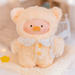 Lulu the Piggy Disciplined plush keychain in soft peach sleep outfit holding a pillow