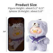 Lulu the Piggy Joyful Time blind box size-comparison graphic: purple teddy plush beside 5.8-inch iPhone 16, indicating figure height range of 5.1-6.5 inches.
