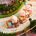 Lulu The Piggy Lululand Series Blind Box fairground train scene with LuLu figures riding a colourful miniature train